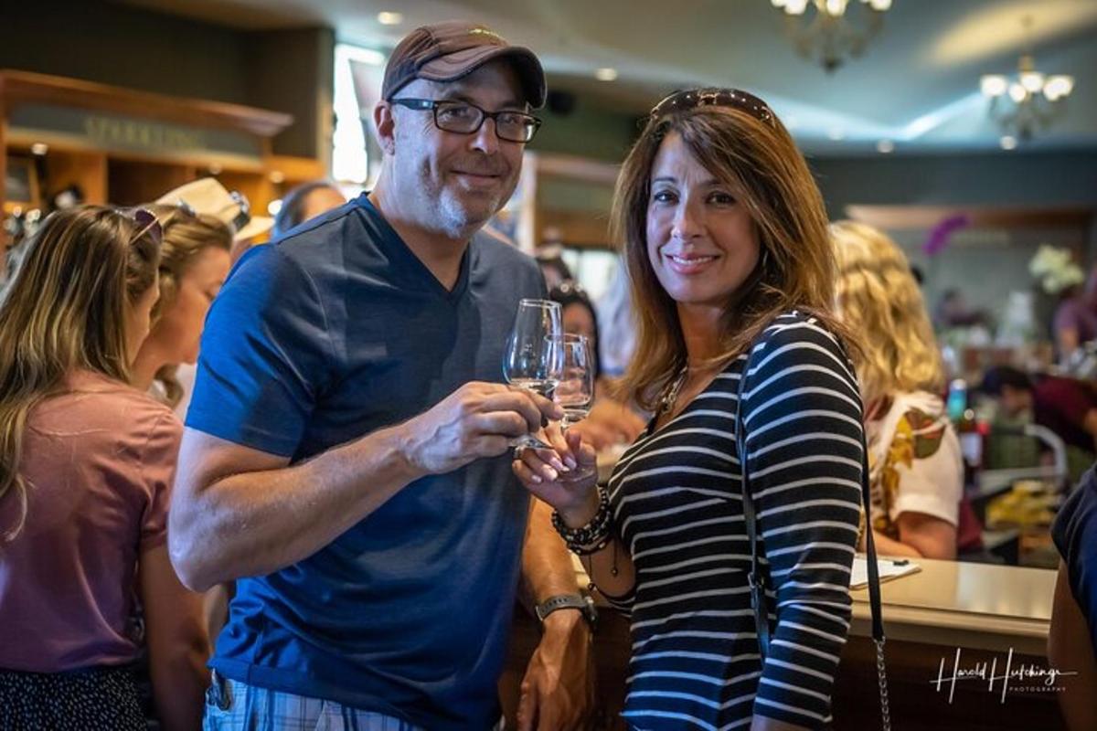a man and a woman holding glasses of wine