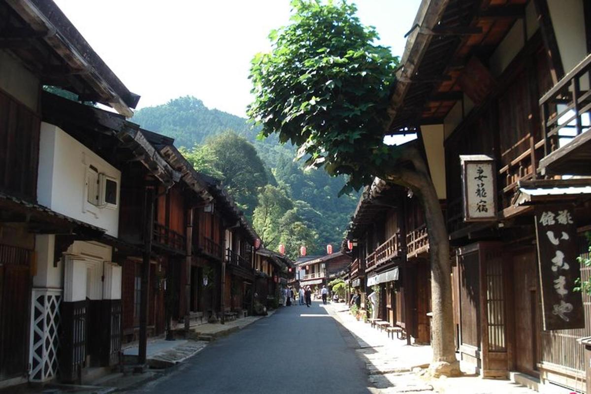 an empty street in an asian town with buildings