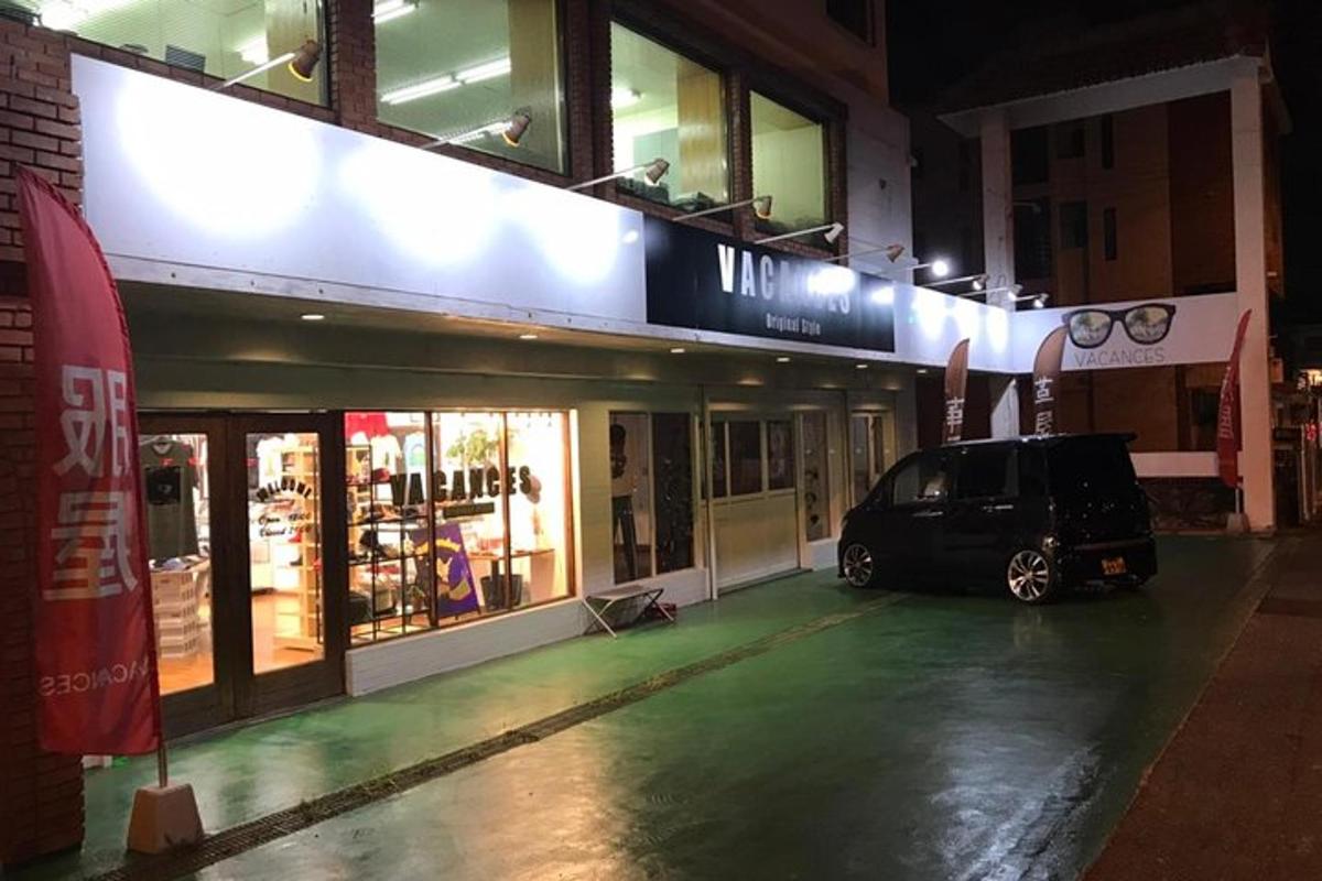 a car parked in front of a store at night