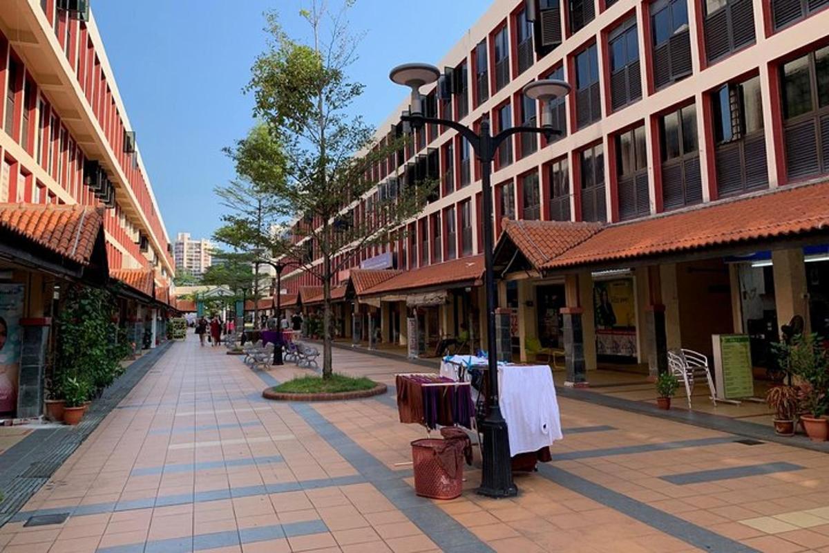 an empty city street with buildings and a street light