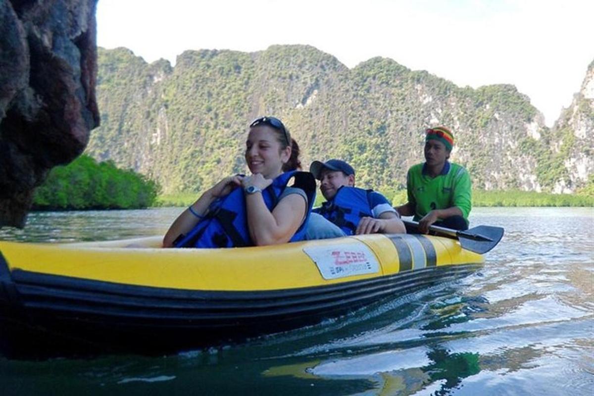 a group of people in a boat on the water