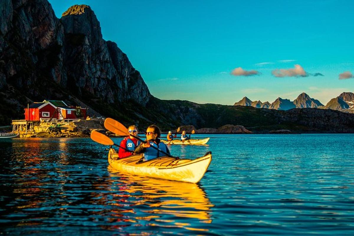 two people in a kayak on a body of water