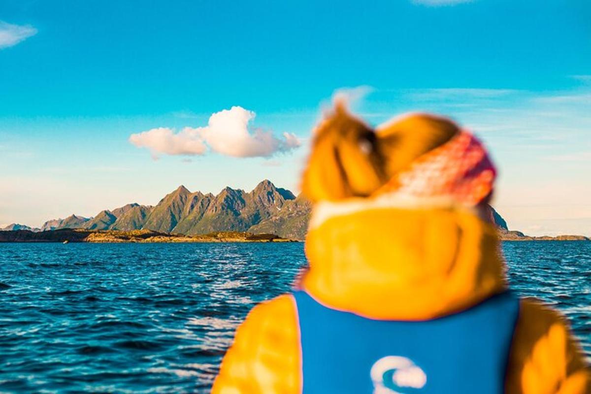 a person in a life vest looking at the ocean