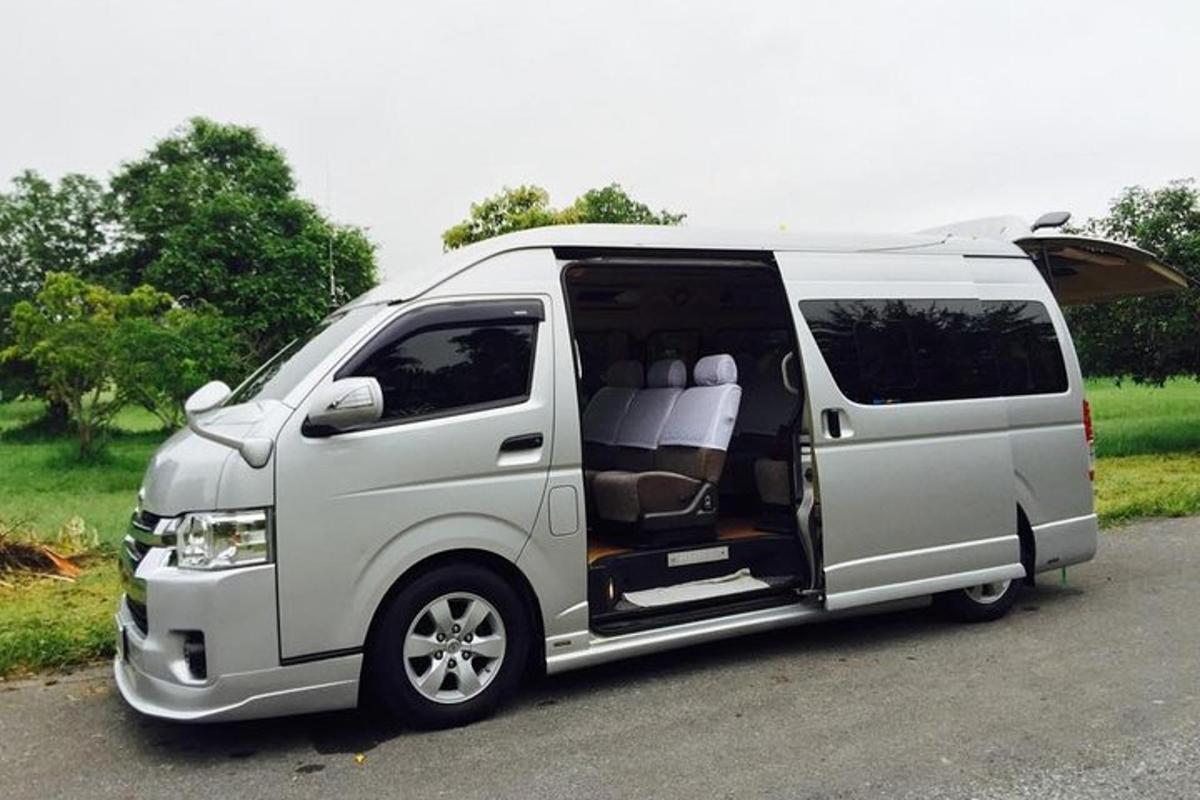 a white van with its door open on a road