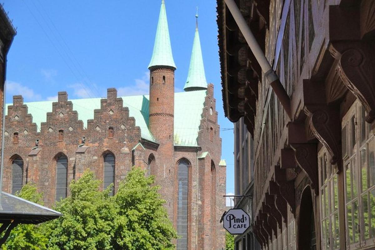 a large castle with towers on a city street