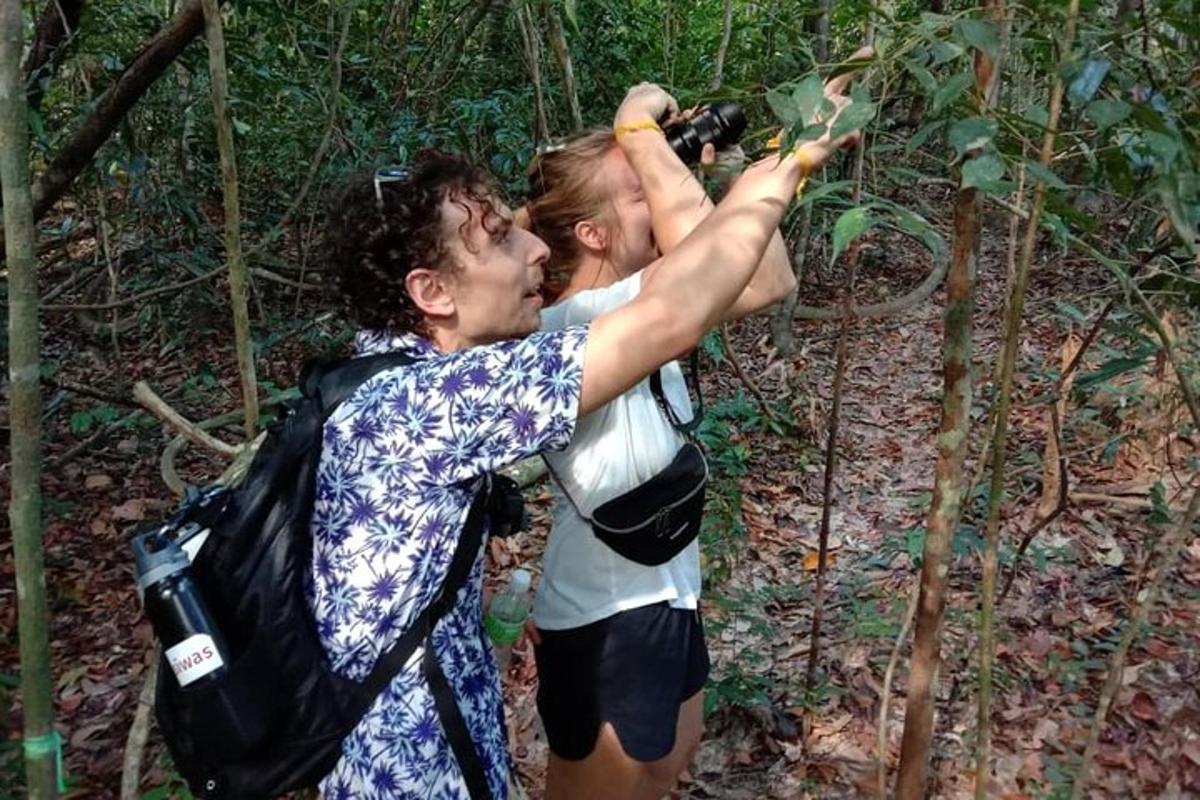 a man taking a picture of a woman with a camera