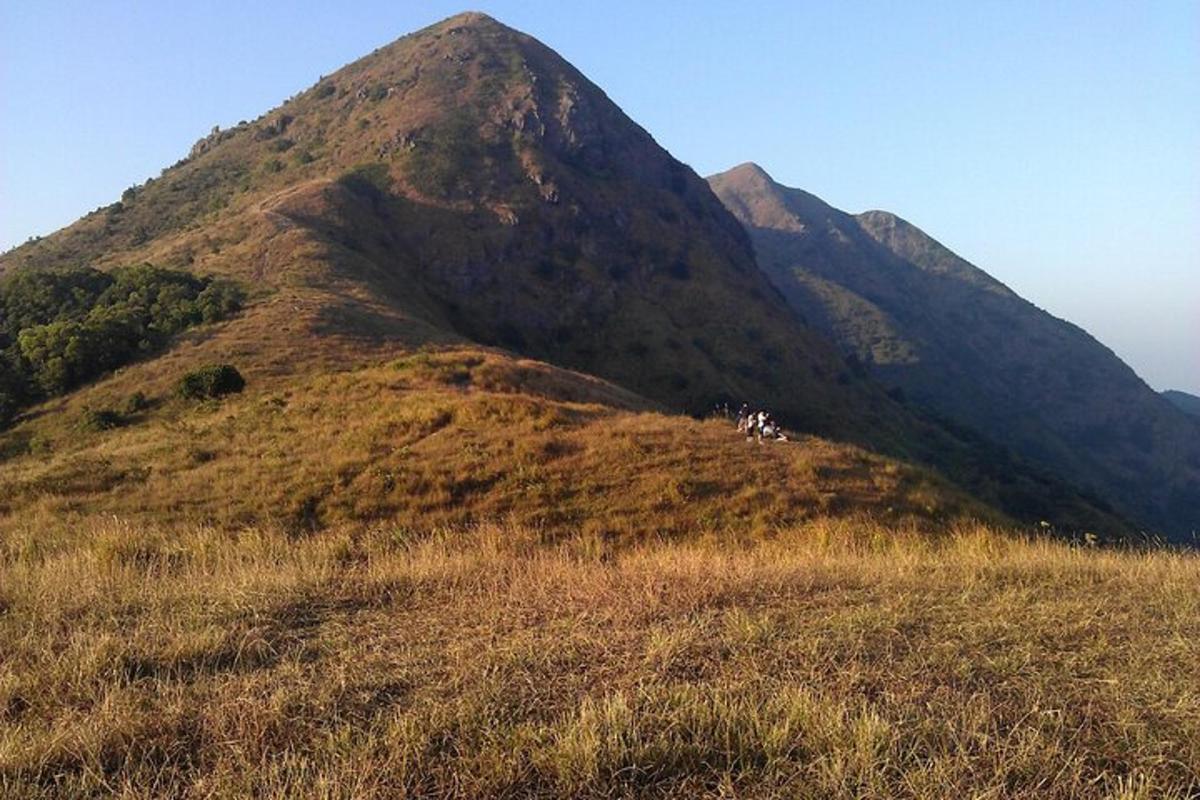 a large hill with a mountain in the background