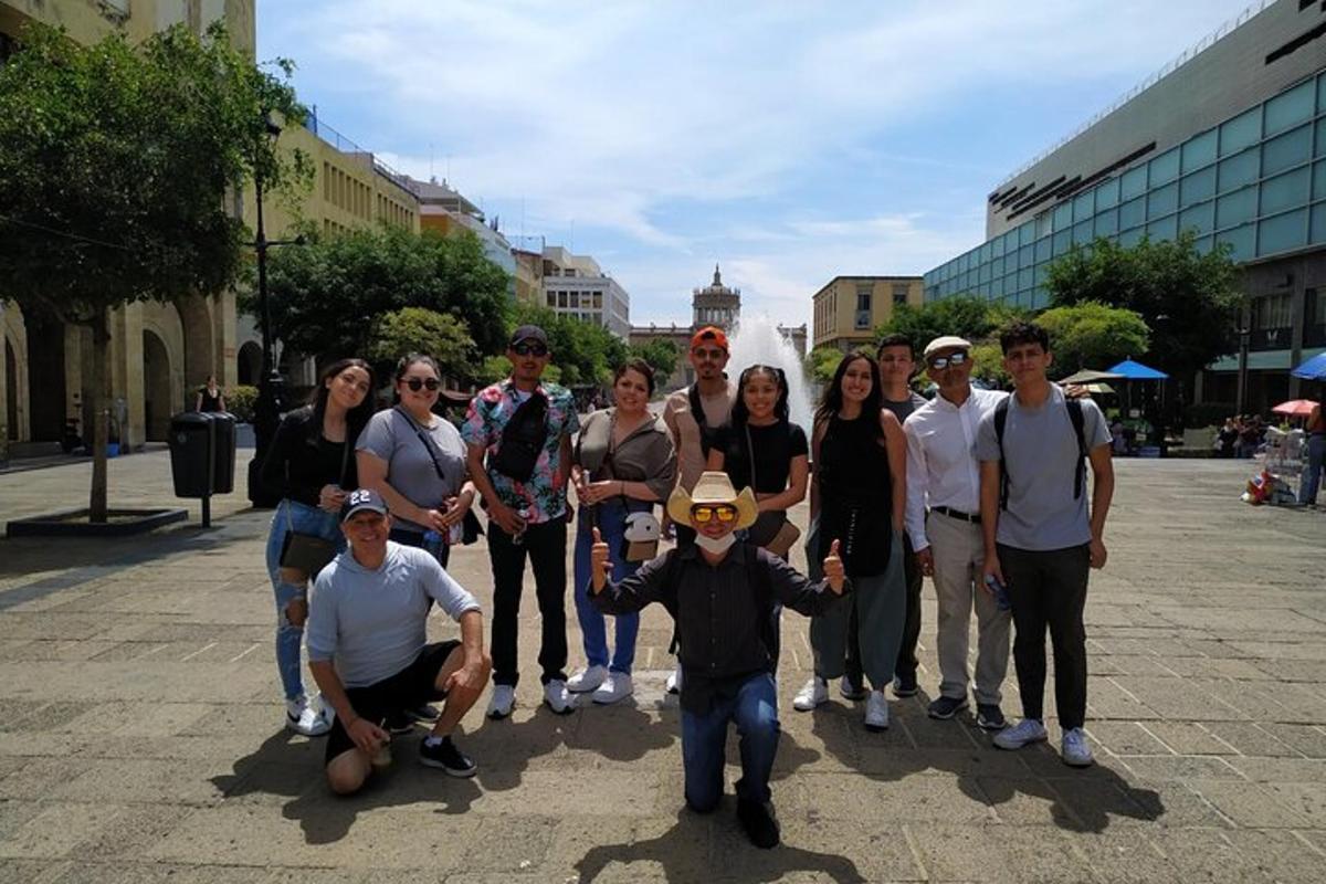 a group of people posing for a picture on a street