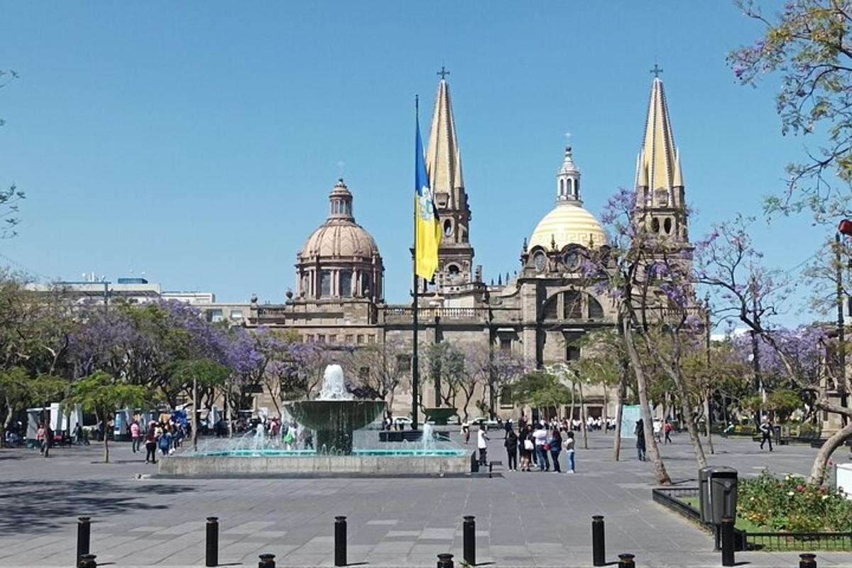 a large building with a fountain in front of it