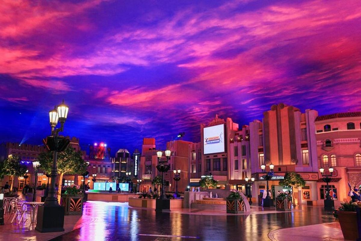 a city at night with a purple and red sky
