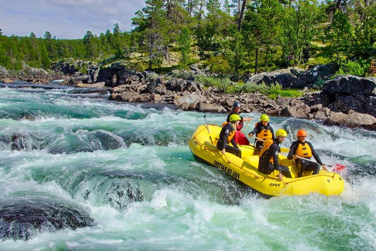 a group of people in a raft on a river