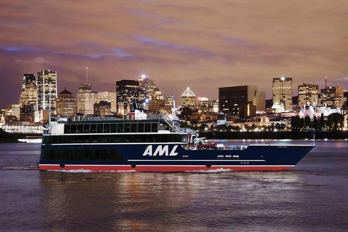 a large ship in the water with a city in the background
