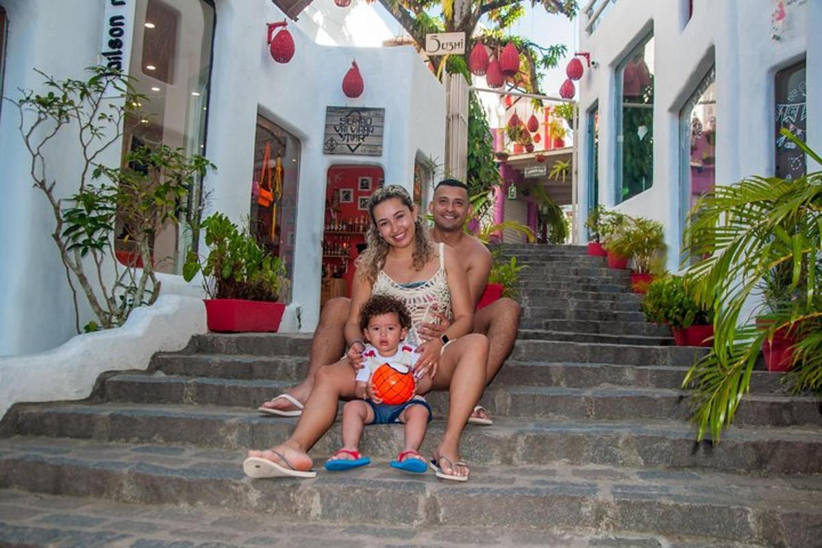 a group of people sitting on the stairs with a child