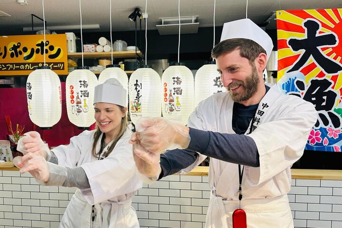 a man and a woman holding hands in a kitchen