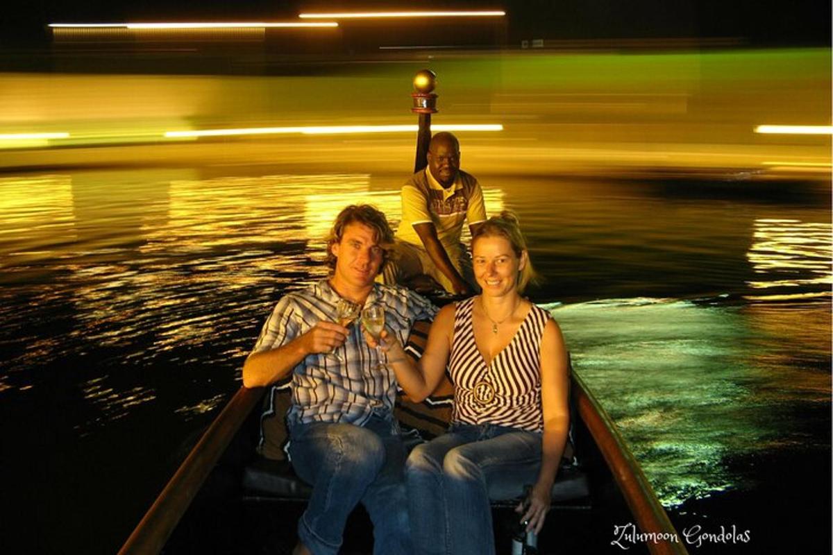 a man and a woman sitting in a boat on the water