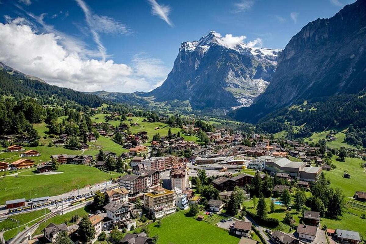 an aerial view of a town in the mountains