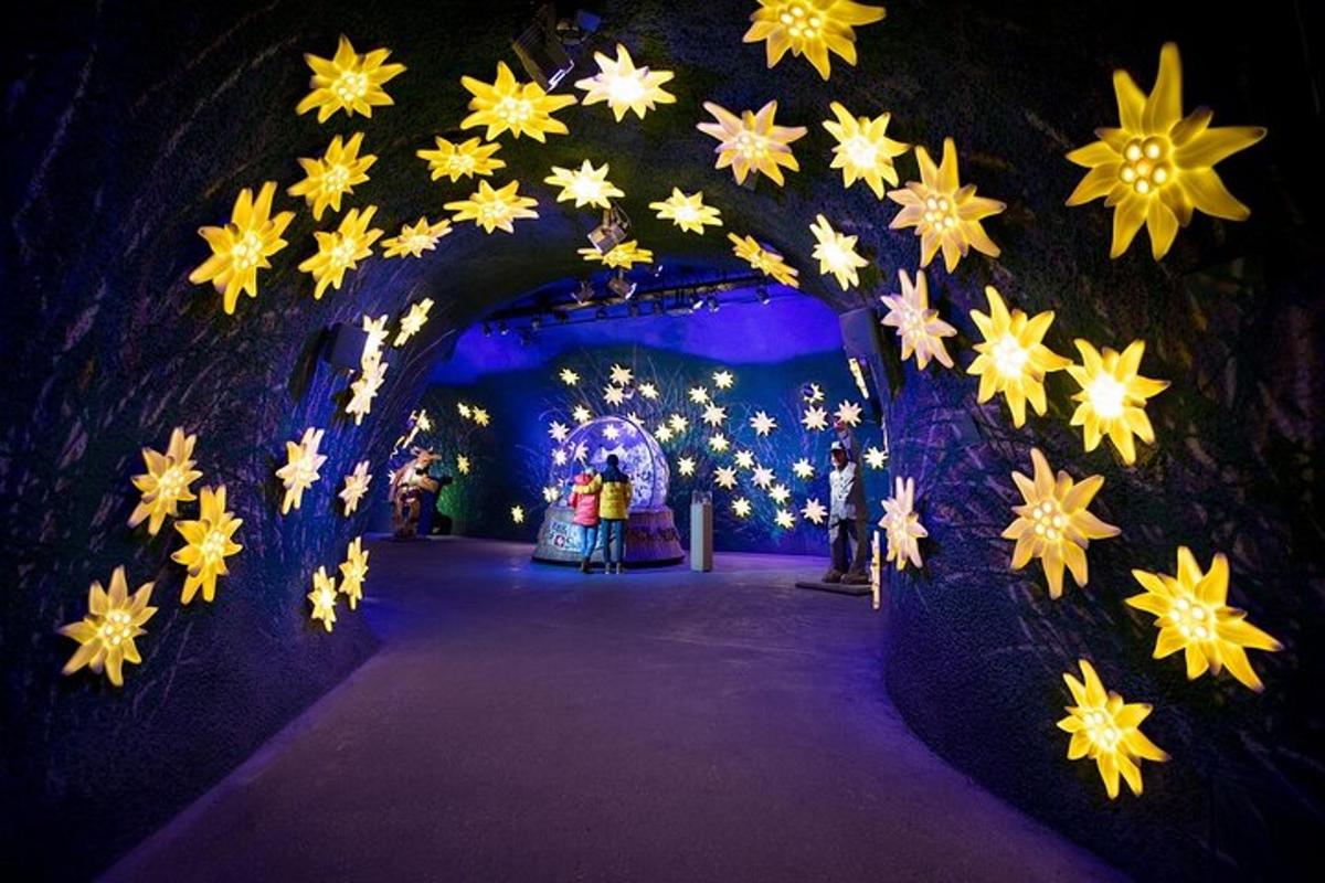 a tunnel filled with yellow and white stars