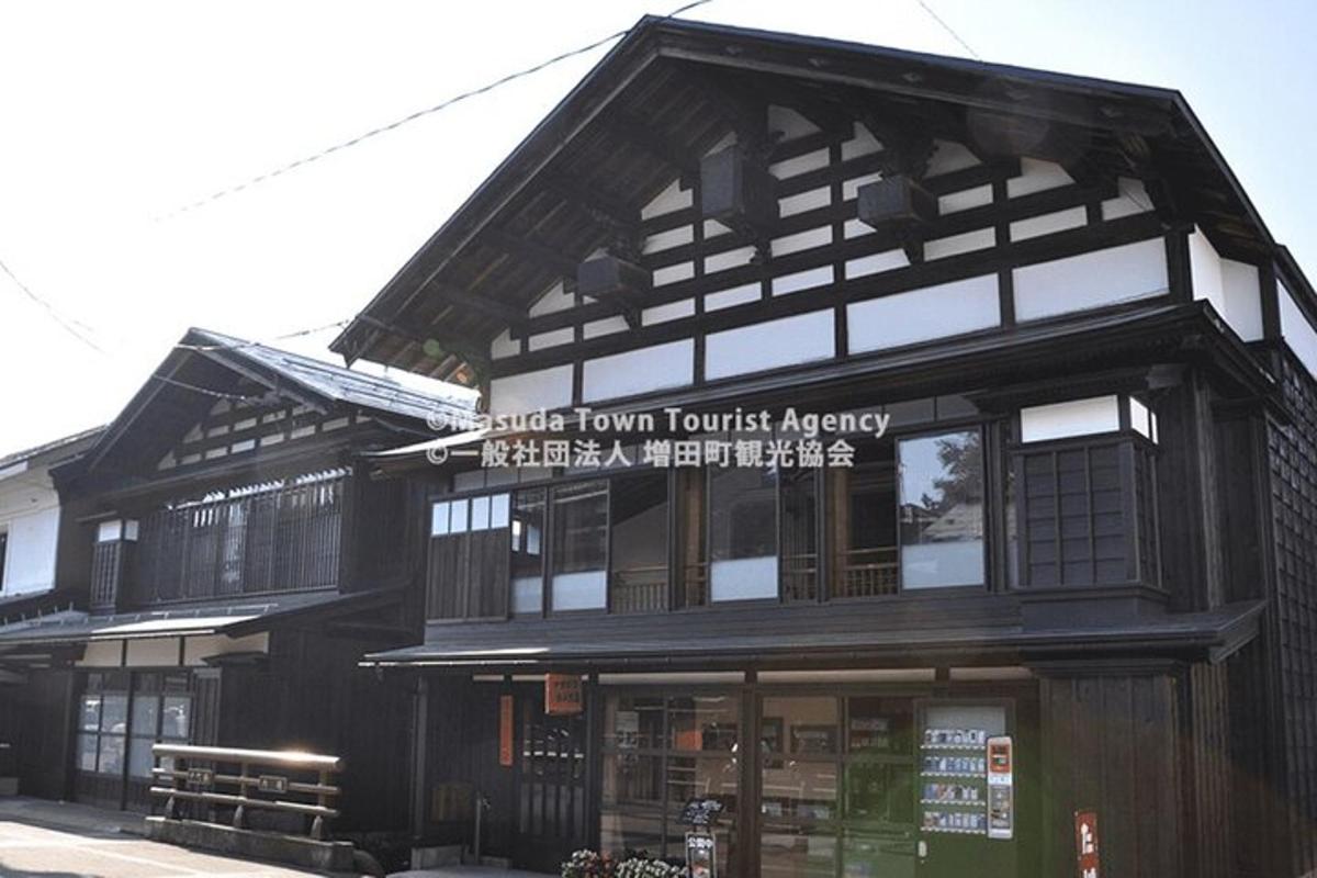 a building with a sign that reads guest town touristagency