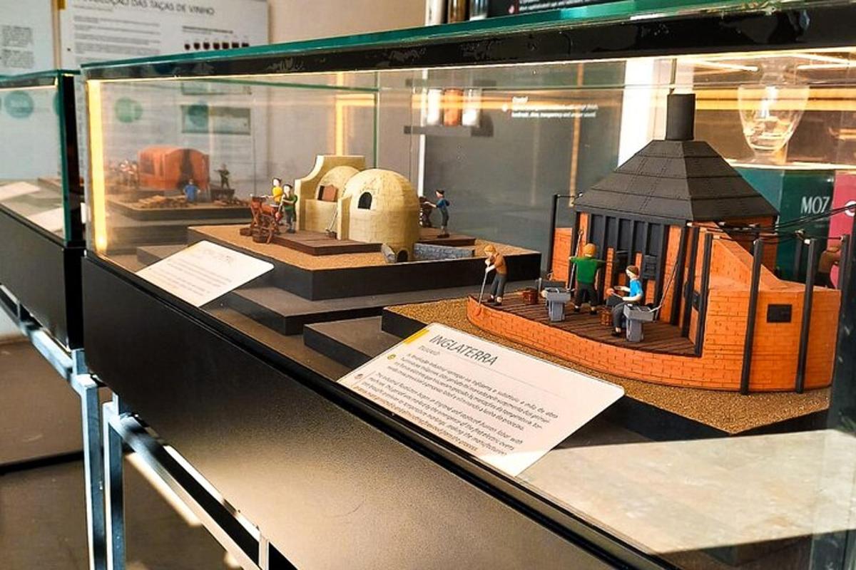 a model of a house in a glass display case