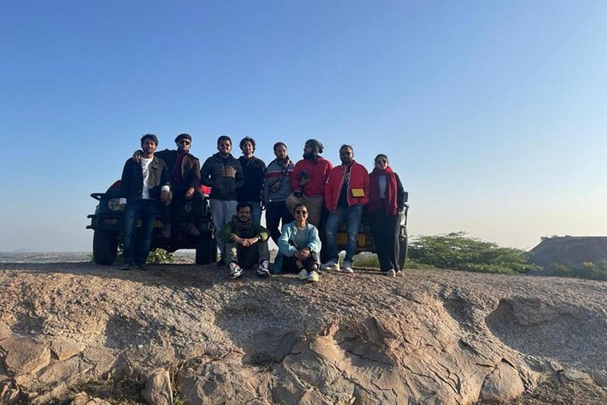 a group of people standing on top of a hill