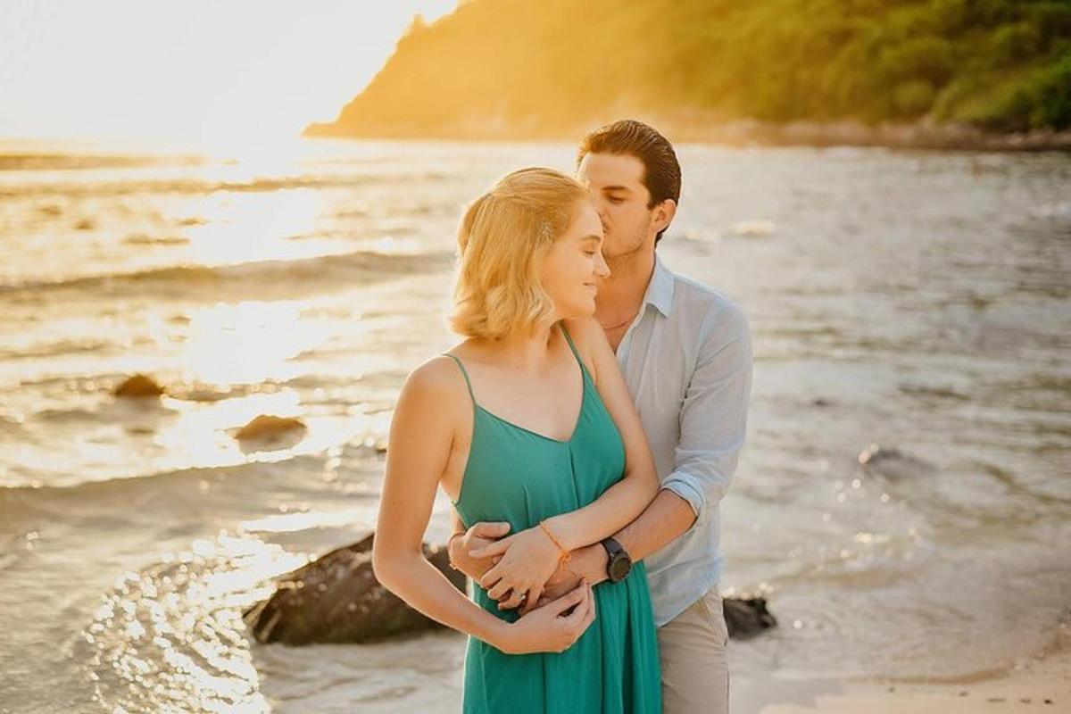 a man and a woman standing on the beach