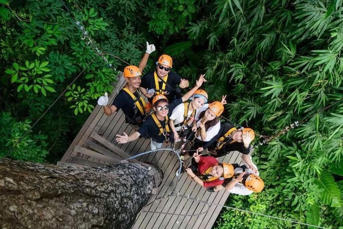 a group of people on a raft in the jungle