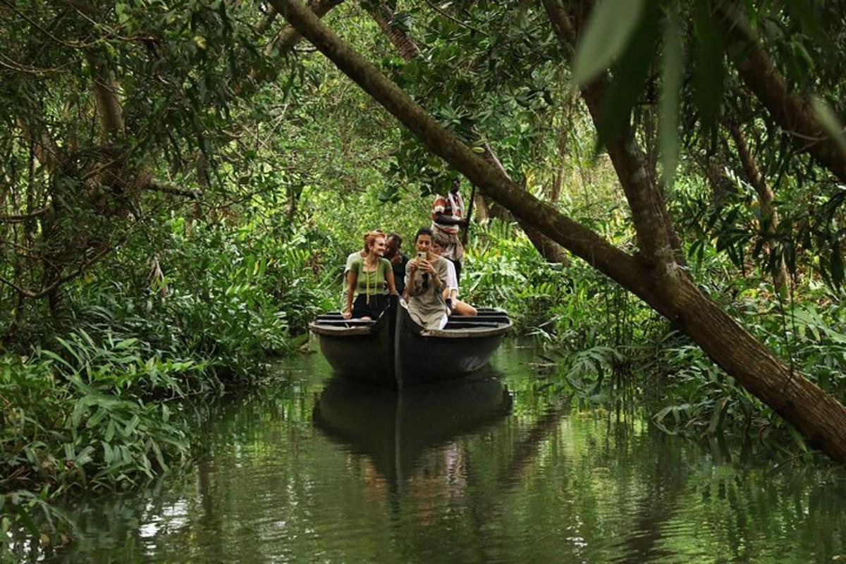 a group of people in a boat on a river