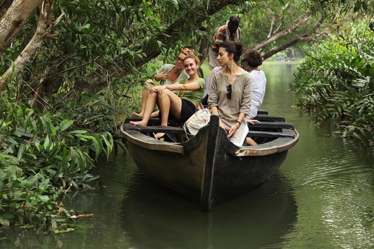 a group of people sitting on a boat in the water