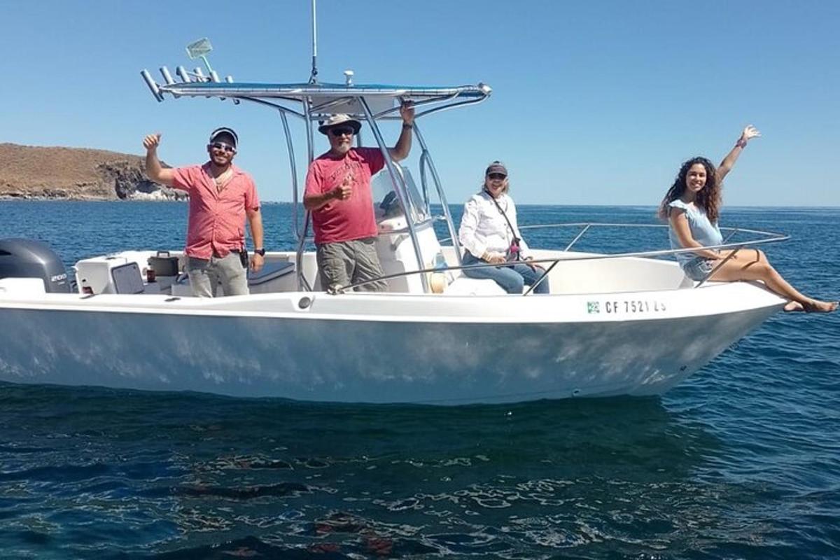 a group of people on a boat in the water