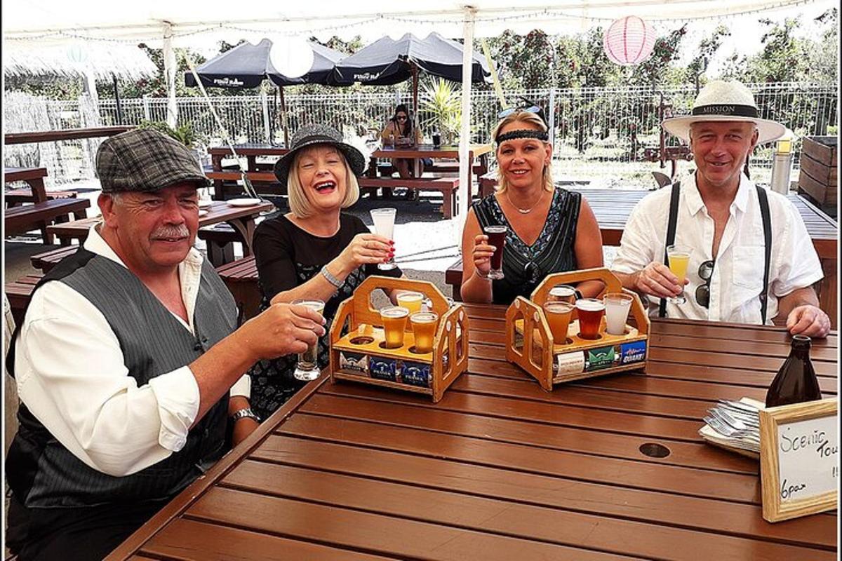 a group of people sitting at a table with drinks