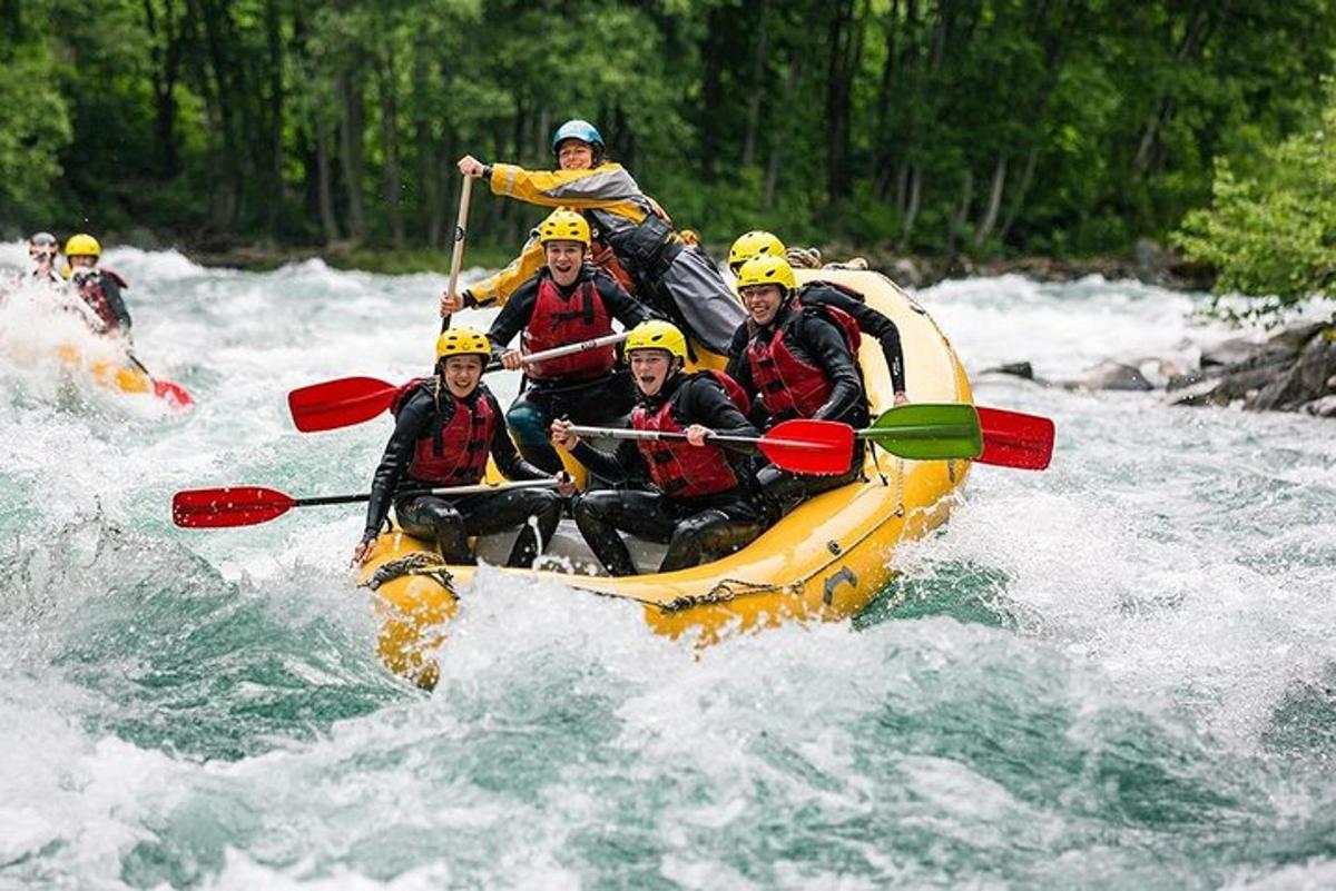 a group of people in a raft on a river