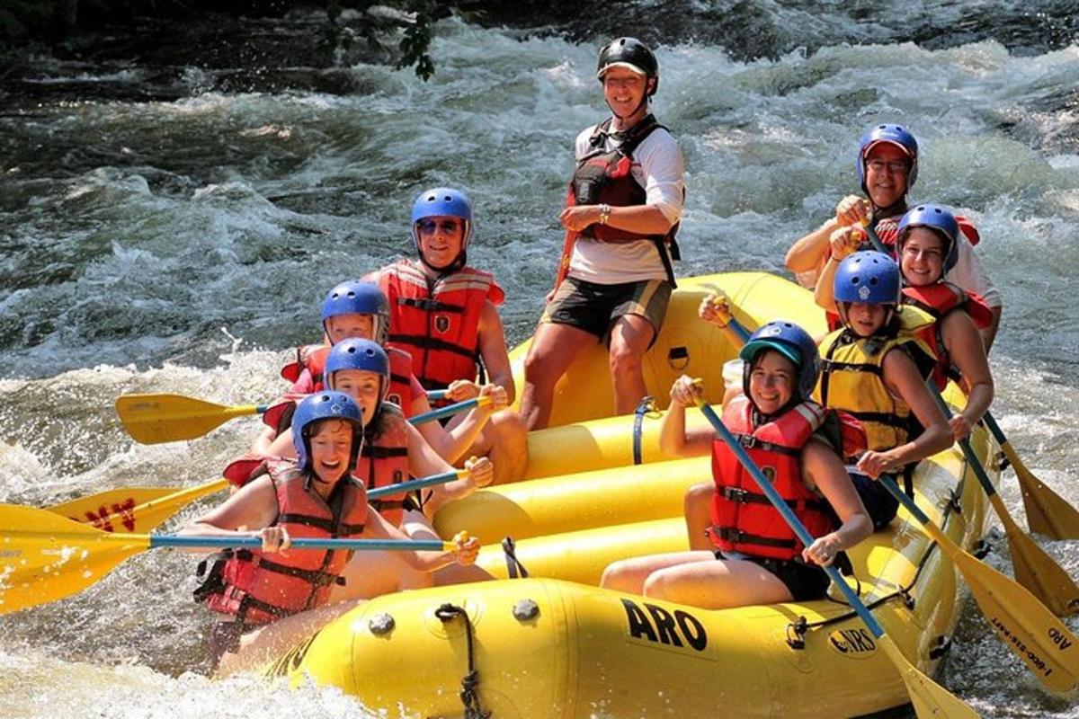 a group of people on a raft in the water