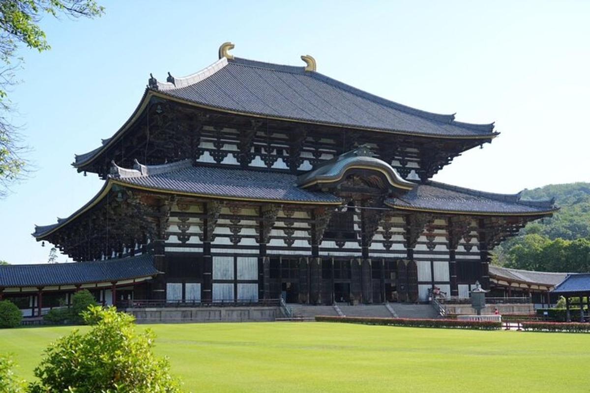 a large building with a roof in a field
