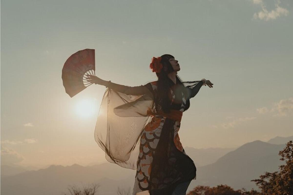 a woman is holding an umbrella in the sky