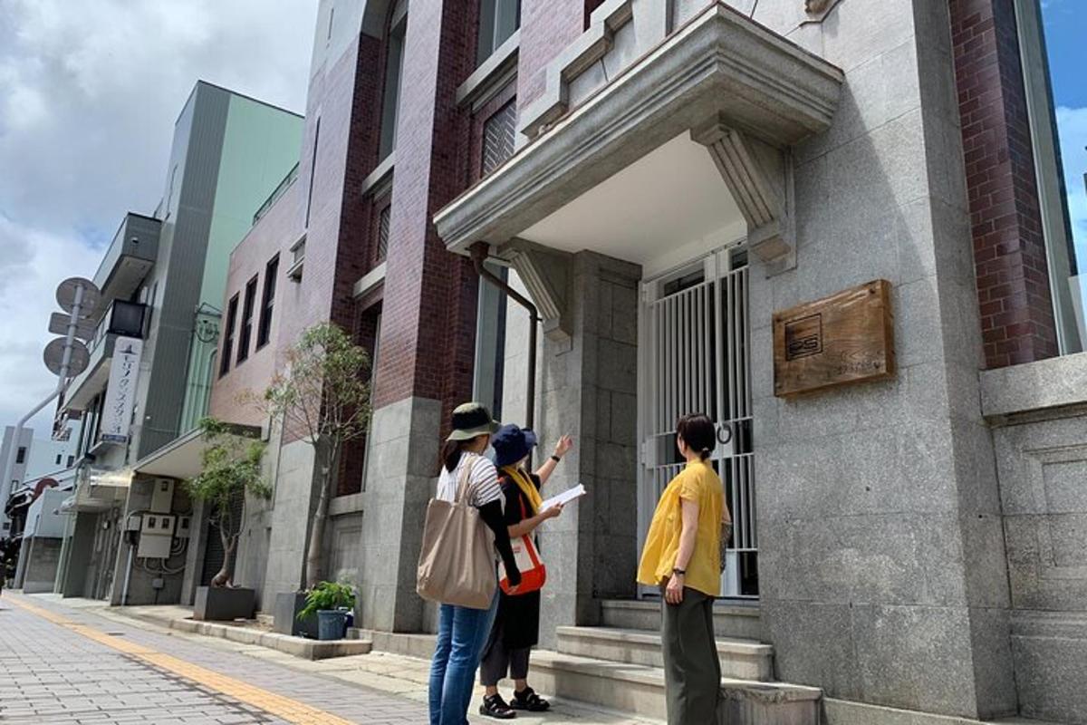 a group of people standing outside of a building
