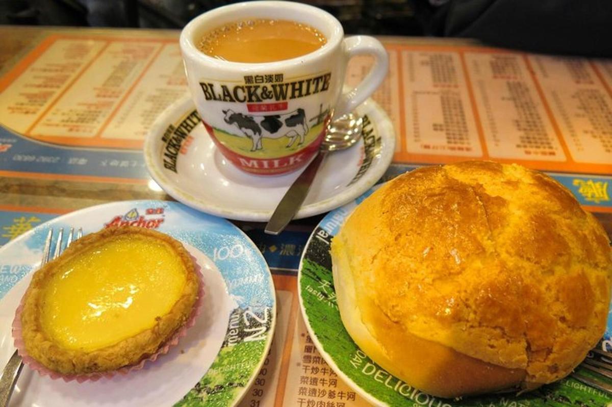 a table with two plates of food and a cup of coffee