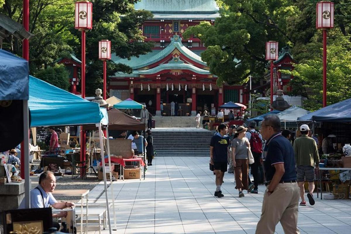a group of people walking around an outdoor market