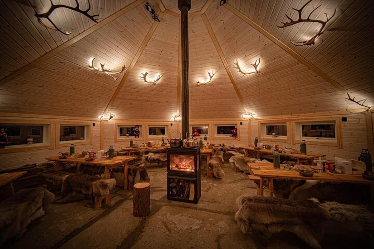 a large room with wooden tables and a fireplace