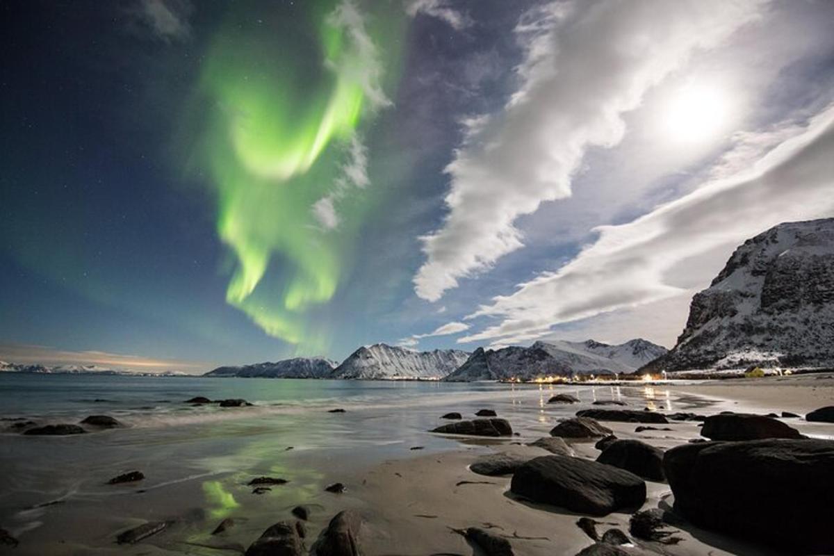 an image of a beach with the northern lights