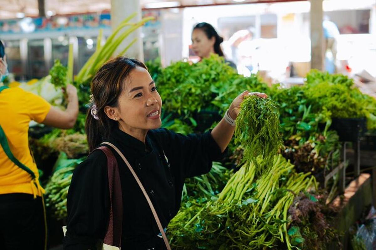 a woman holding up a bunch of vegetables in a market