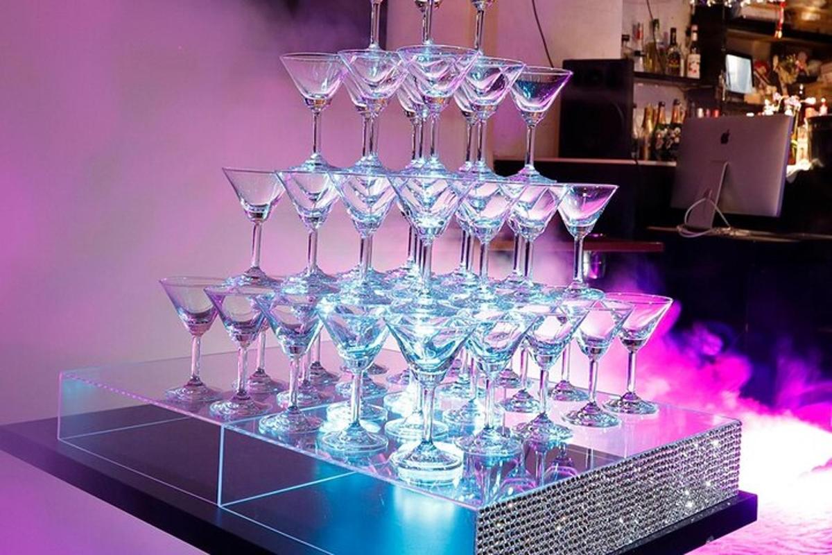 a bunch of wine glasses sitting on a table