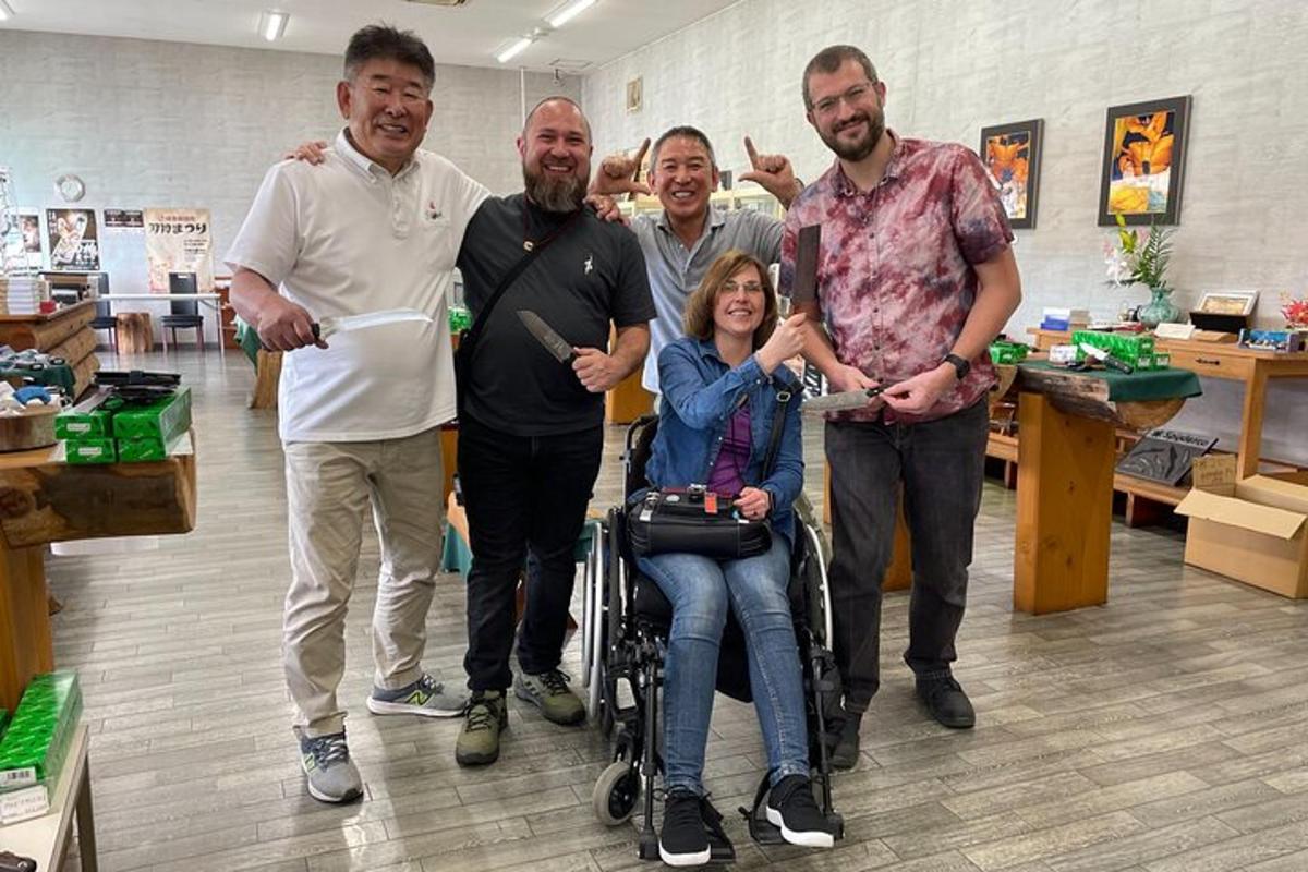 a group of men standing around a woman in a wheelchair