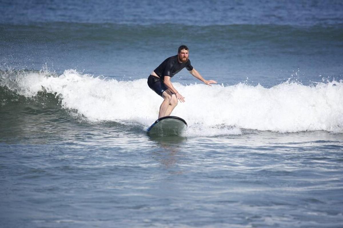 a man riding a wave on a surfboard in the ocean
