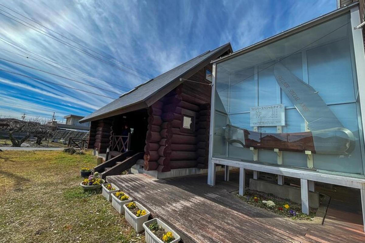 a building with a window on a wooden deck