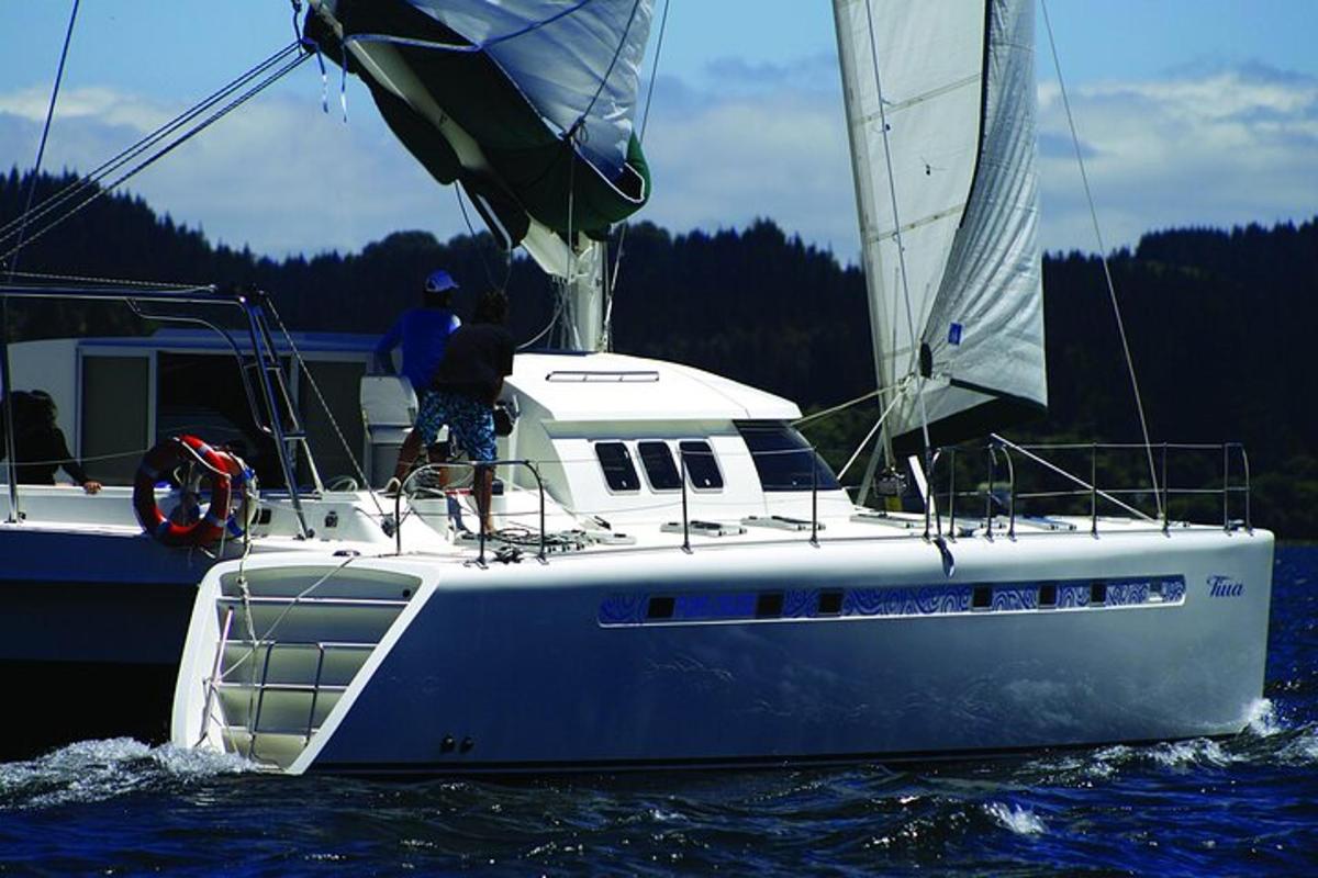 a man on a sail boat in the water