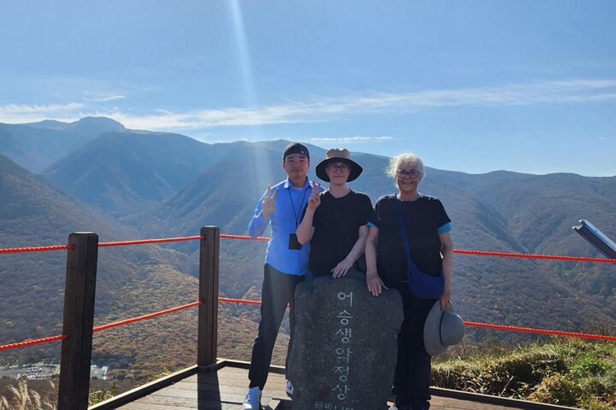 a group of people standing on top of a mountain