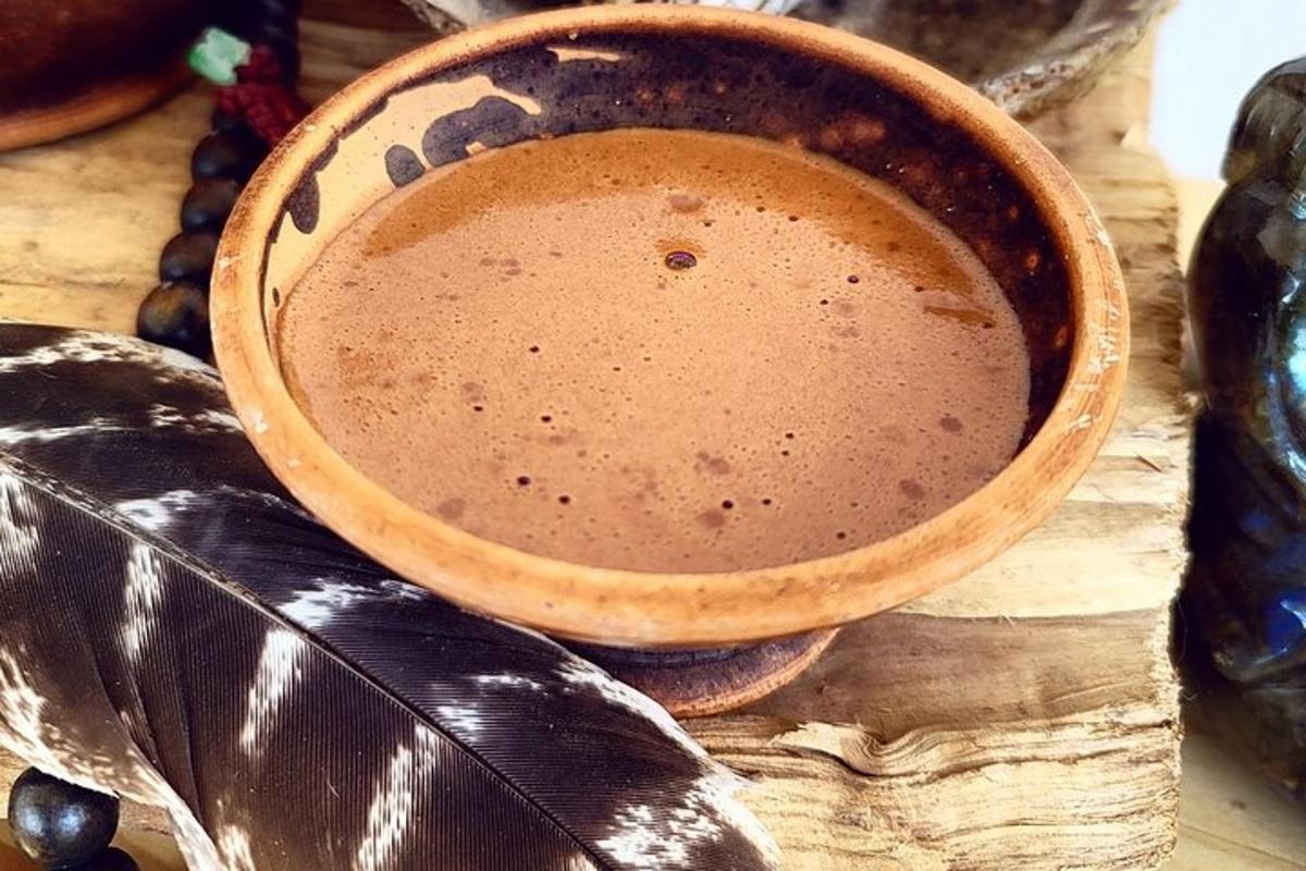 a bowl of liquid sitting on top of a table