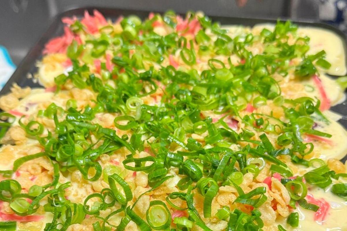 a pizza with green peppers on top of it