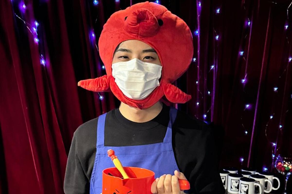 a man wearing a red hat and a mask