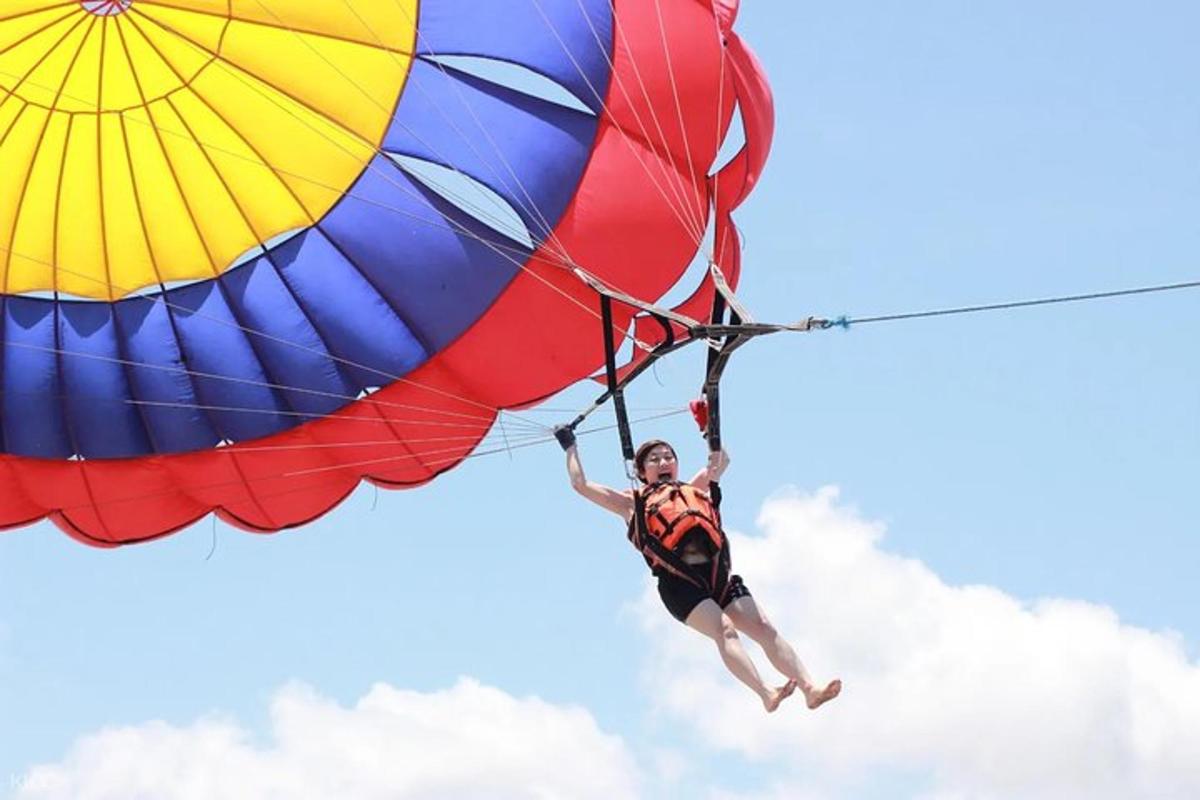 a person is hanging from a parachute